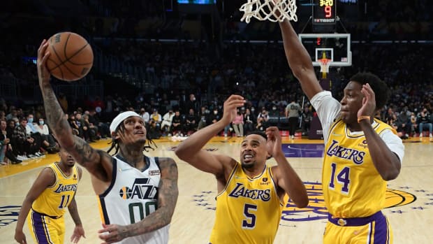 Los Angeles Lakers guard Talen Horton-Tucker (5) and Los Angeles Lakers forward Stanley Johnson (14) defend Utah Jazz guard Jordan Clarkson (00) as he goes to the basket in the second half of the game at Crypto.com Arena.